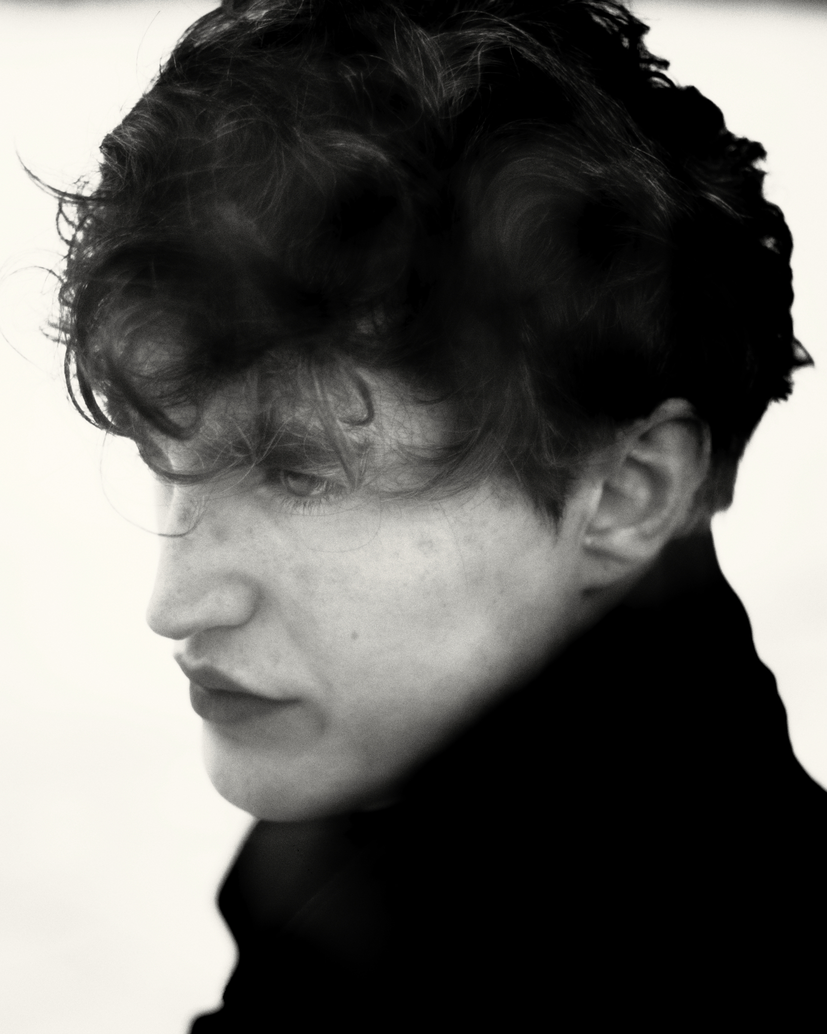 Young male actor with curly hair